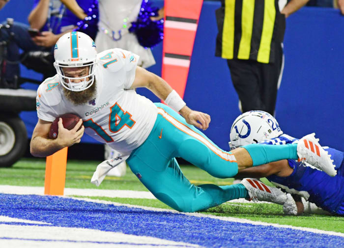 Dolphins quarterback Ryan Fitzpatrick dives past the goal line for a touchdown against the Colts. After starting a game in 2019, he became the 20th player to start for the Dolphins since Hall of Famer Dan Marino retired in 1999.